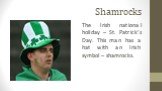 Shamrocks. The Irish national holiday – St. Patrick’s Day. This man has a hat with an Irish symbol – shamrocks.